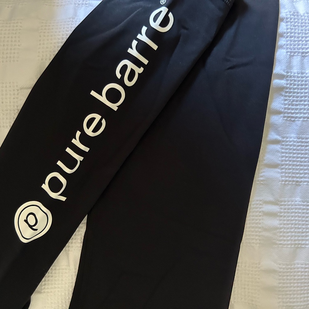 Black Lululemon Wunder Under leggings, size 6 Pure Barre logo on leg.